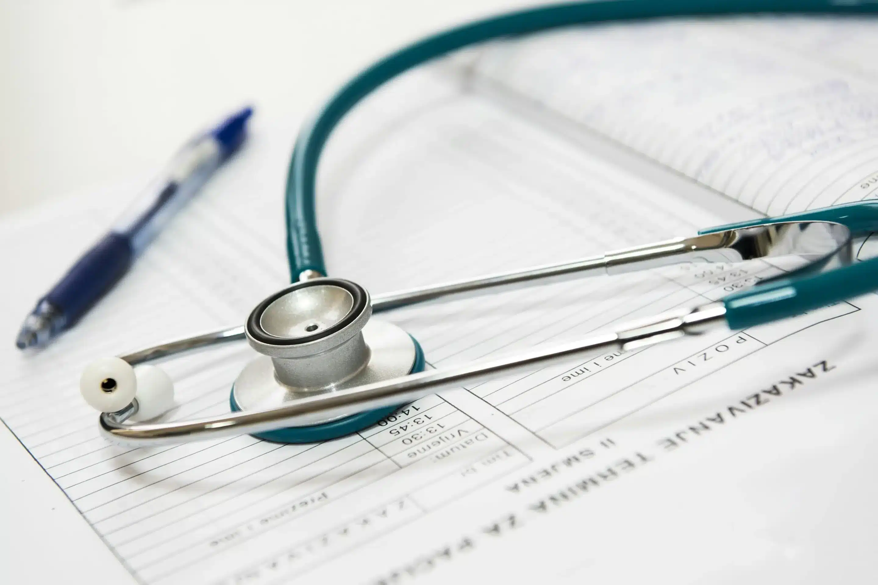New Patient CPT Codes: A Guide for 2025 A stethoscope lying on a medical document of patient codes.