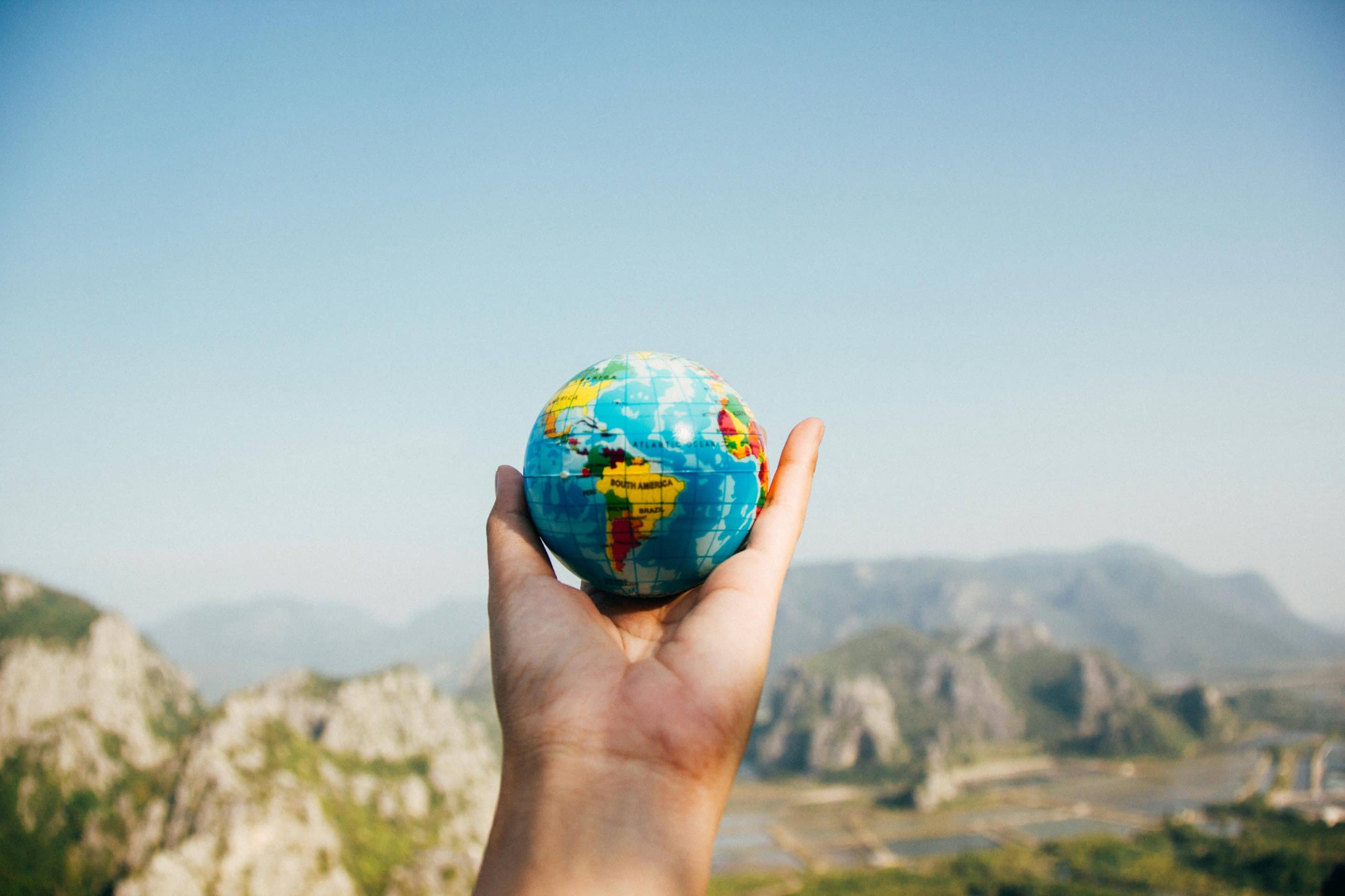 Globe in a Person's Hand