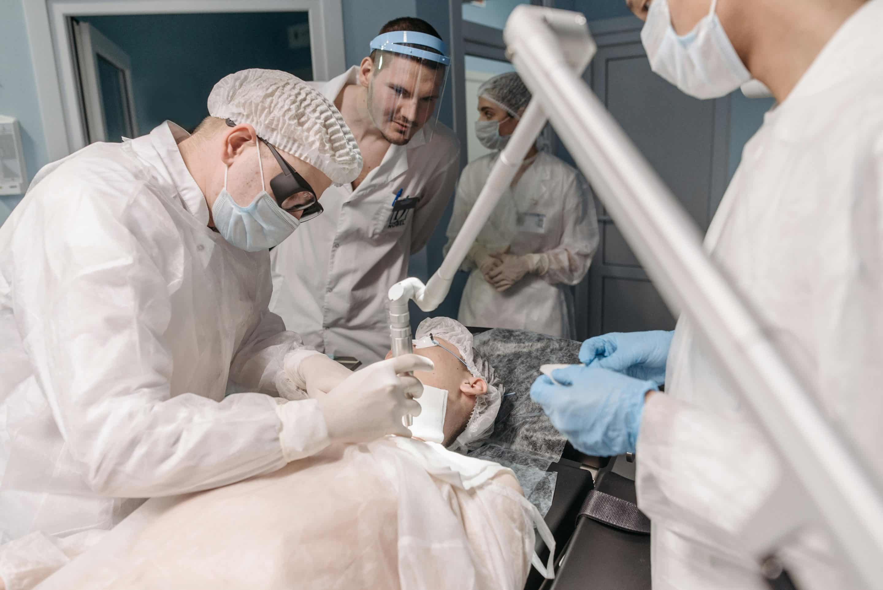 Doctor performing plastic surgery
